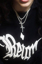 Load image into Gallery viewer, An image showing Icy Cross Pendant hanging on the neck of a person