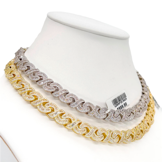 A baguette diamond necklace placed round the neck of a doll for show casing